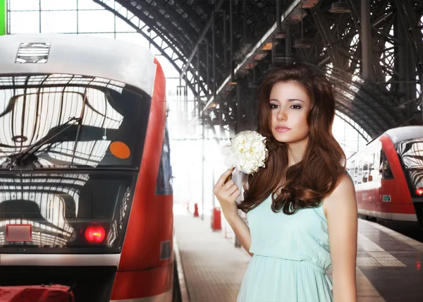 Urban Scene. Woman and Train. Railway Station