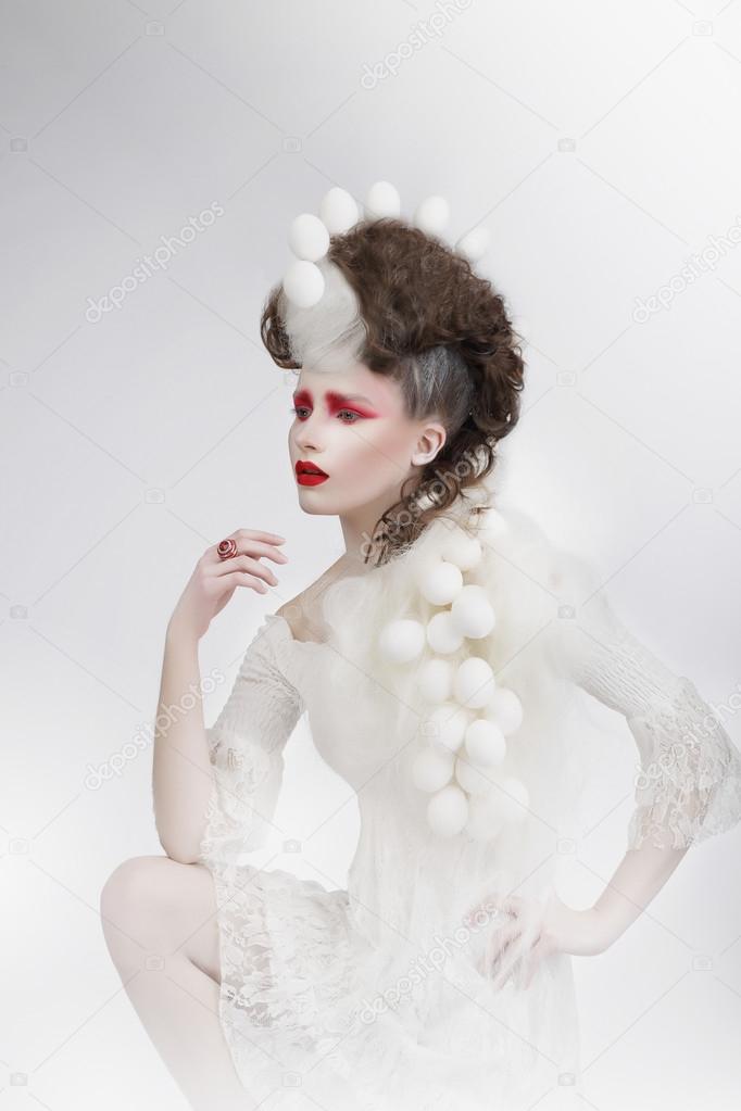 Stylization. Woman with Eggshells and Art Fancy Makeup. Fantasy