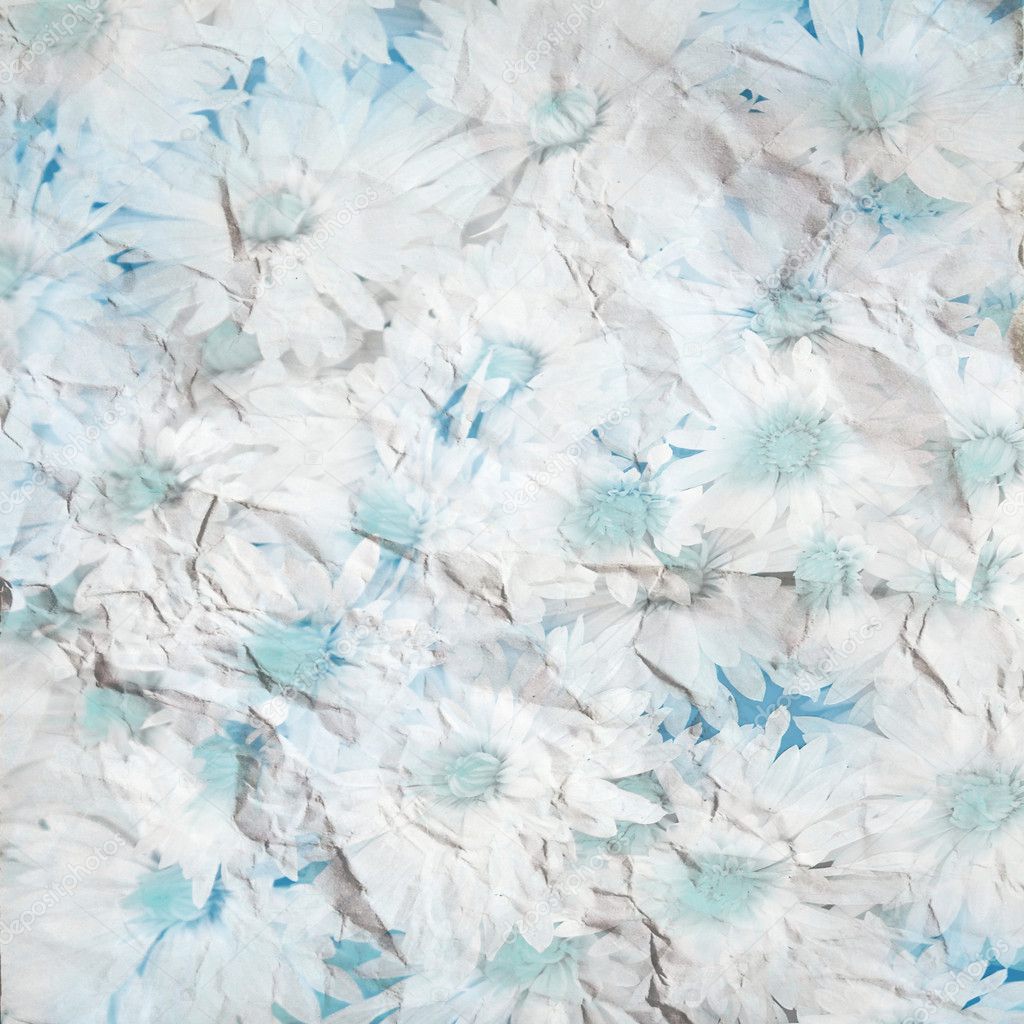 bright blue flowers on crumbled paper