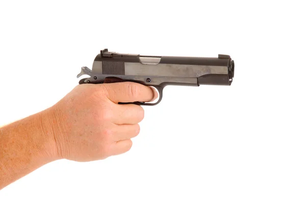 Semi-automatic handgun cocked in a hand — Stock Photo, Image