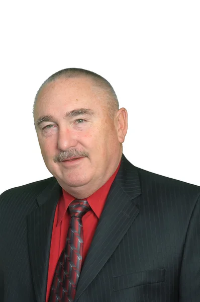 Smiling older businessman in a red shirt — Stock Photo, Image