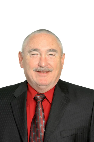 Smiling older businessman in a red shirt — Stock Photo, Image