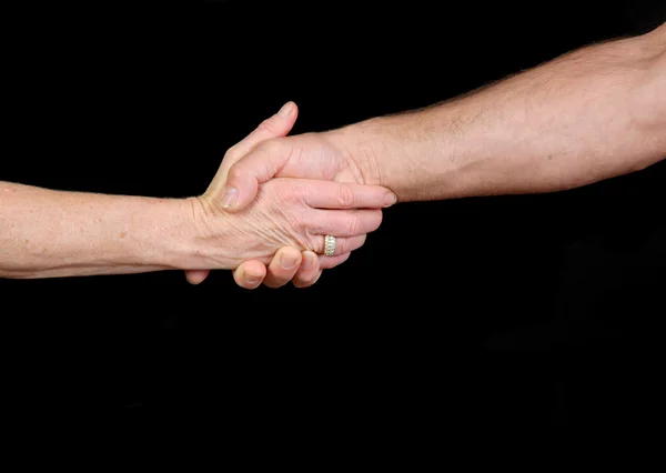 Older couple shaking hands — Stock Photo, Image