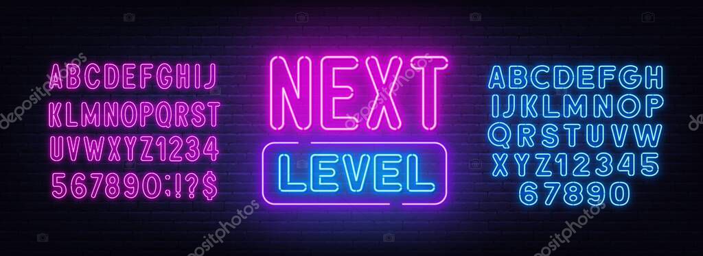 Next level neon sign on brick wall background. Neon blue and pink alphabet on brick wall background.