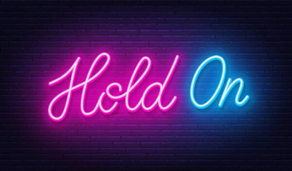 Hold On neon lettering on brick wall background.