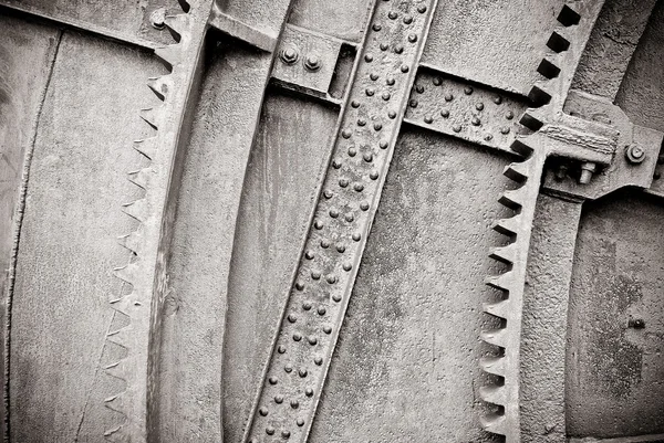 Background old machine with gears and rivets, black and white — Stock Photo, Image