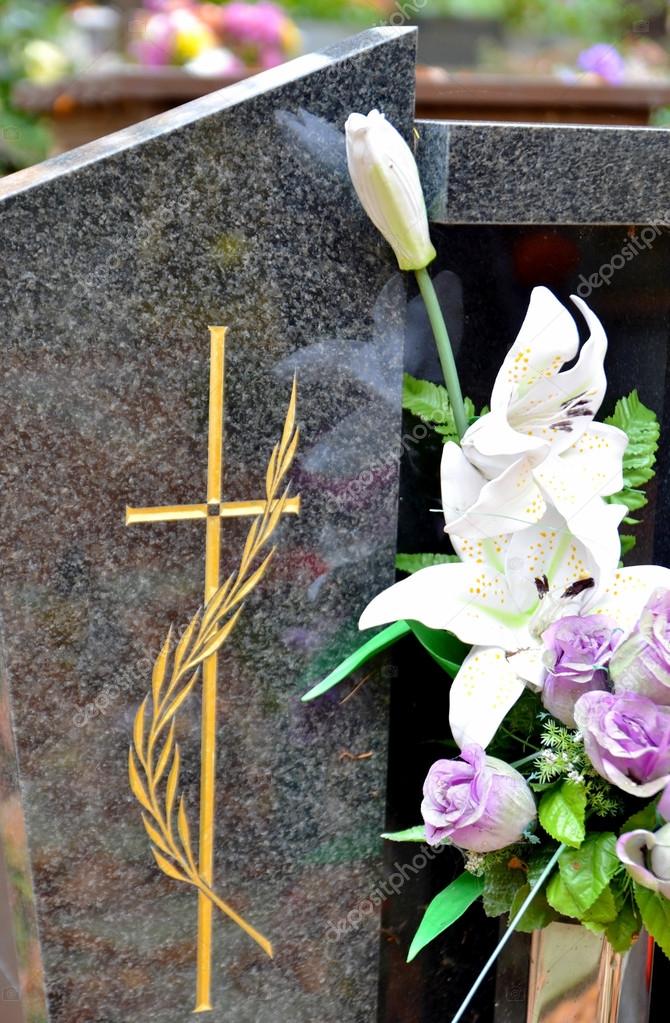 Tombstone with cross and flowers Stock Photo by ©kytalpa 14772649
