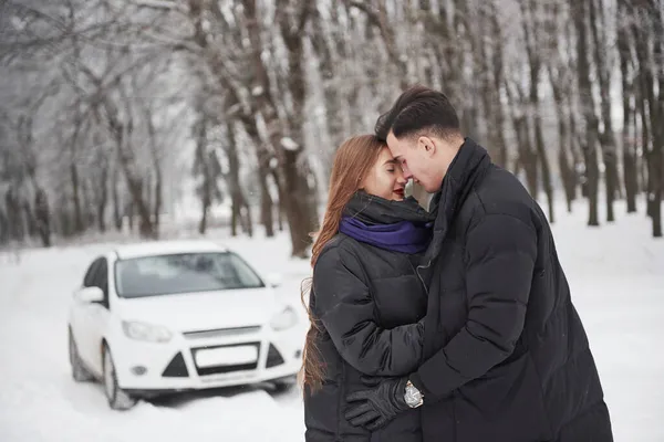 Feeling Pleasure Gorgeous Young Couple Stands Front White Automobile Snowy — Stock Photo, Image