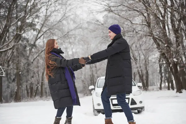 Holding Hands Gorgeous Young Couple Dancing Front White Automobile Snowy — Stock Photo, Image