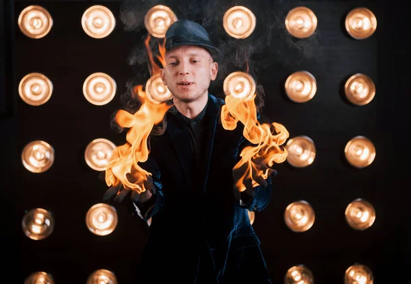 Fire His Hands Professional Magician Showing Trick Light Bulbs Background — Stock Photo, Image