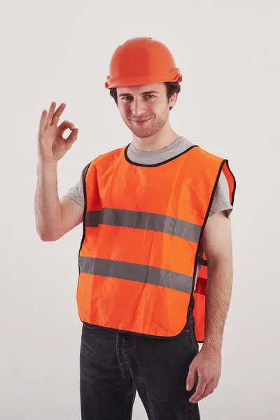 Everything Okay Man Orange Colored Uniform Stands White Background Studio — Stock Photo, Image