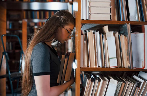 Leaning Shelves Feels Tired Female Student Library Full Books Conception — Stock Photo, Image
