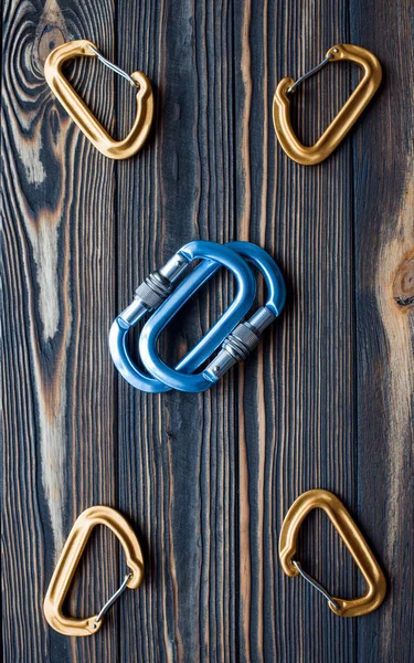 Many Objects Isolated Photo Climbing Equipment Parts Carabiners Lying Wooden — Stock Photo, Image