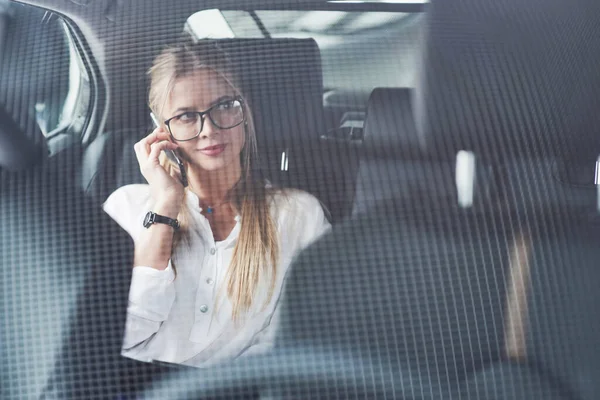 Glass Beautiful Blonde Girl Sitting New Car Modern Black Interior — стоковое фото