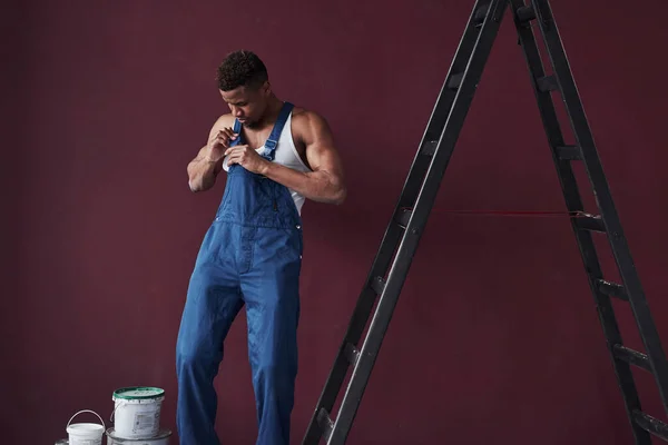 Wearing Clothes Young African American Worker Blue Uniform Have Some — Stock Photo, Image