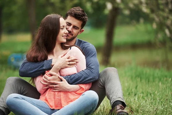 Sitting Together Outdoors Spring Time Young Couple Embracing — Fotografia de Stock