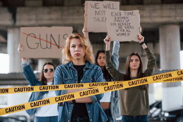 Hands is up. Group of feminist women have protest for their rights outdoors.