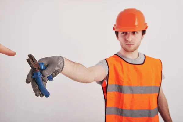 Another Person Takes Tool Man Orange Colored Uniform Stands White — Stock Photo, Image