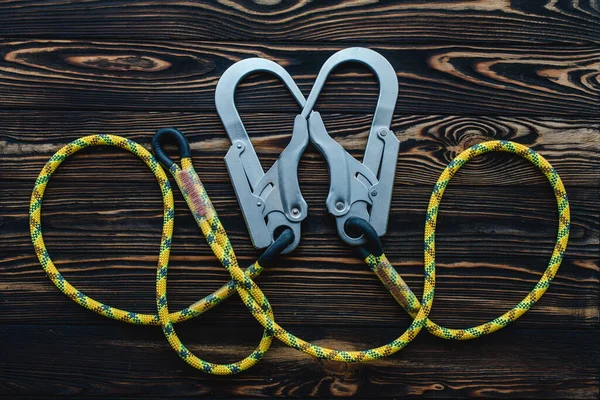 Connected Ropes Isolated Photo Climbing Equipment Parts Carabiners Lying Wooden — Stock Photo, Image