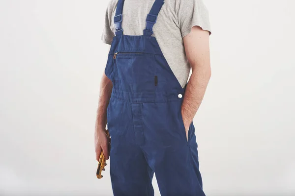 Cropped Photo Man Blue Uniform Stands White Background Studio — Stockfoto