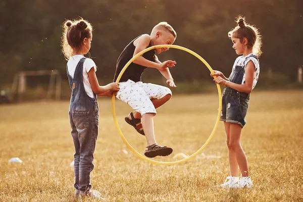 Jumping Circle Fitness Tool Kids Having Fun Field — Stock Photo, Image