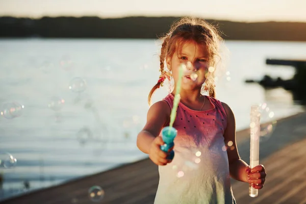 Amazing Sunlight Happy Little Girl Playing Bubbles Lake Park — Stock Photo, Image