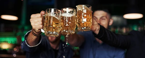 Knocking Glasses Three Sports Fans Bar Watching Soccer Beer Hands — Stock Photo, Image