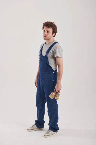 Überlegen Man Zuerst Malen Sollte Mann Blauer Uniform Steht Vor — Stockfoto