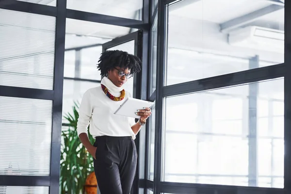 Young African American Woman Glasses Stands Indoors Office Tablet Hands — Stock Photo, Image