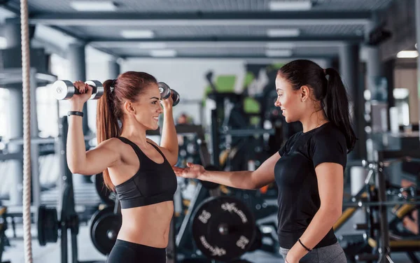 Female Personal Trainer Helping Woman Doing Exercises Gym — Stock Photo, Image