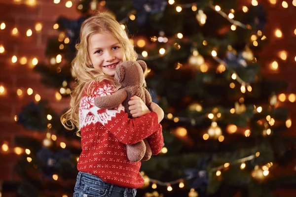 Cute Little Girl Red Festive Sweater Teddy Bear Indoors Celebrating — Stock Photo, Image