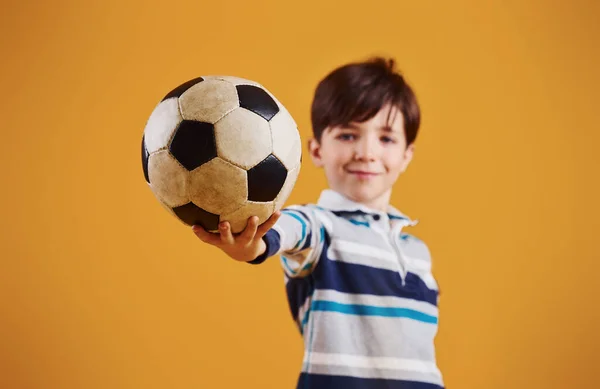 Portrait Young Soccer Player Ball Stands Yellow Background — Stock Photo, Image