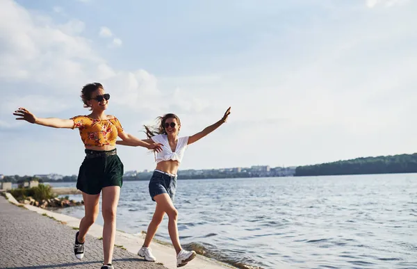Two Female Friends Runs Have Fun Beach Lake Sunny Daytime — Stock Photo, Image