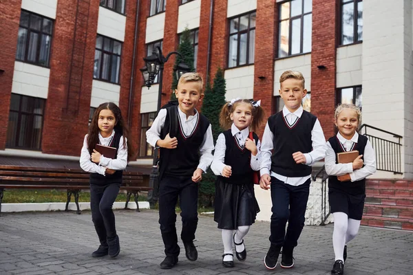 Group Kids School Uniform Posing Camera Outdoors Together Education Building — Stock Photo, Image