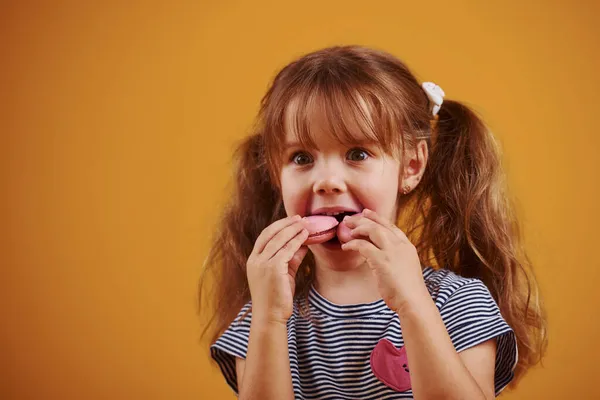 Cute Little Girl Sweet Food Studio Yellow Background — Stock Photo, Image