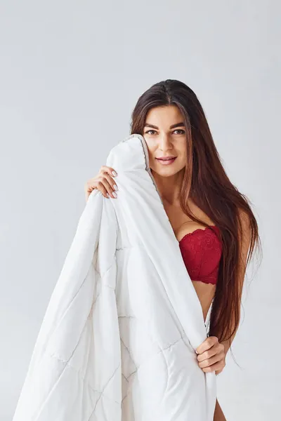 Woman Red Underwear Covering Her Body Towel Studio White Background — Stock Photo, Image