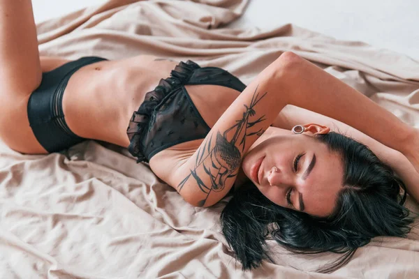 Sexy Attractive Brunette Black Intimate Underwear Tattoos Body Lying Floor — Stock Photo, Image