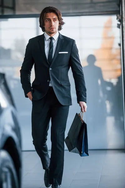 Portrait Handsome Young Businessman Black Suit Tie Shopping Bag Modern — Stock Photo, Image