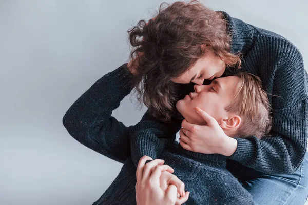 Cute Young Couple Kissing Each Other Indoors Studio — Stock Photo, Image