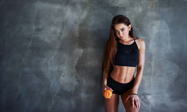 Posing For The Camera. Young Fitness Woman With Slim Type Of Body And In  Black Sportive Clothes Is In The Gym. Stock Photo, Picture and Royalty Free  Image. Image 157225831.