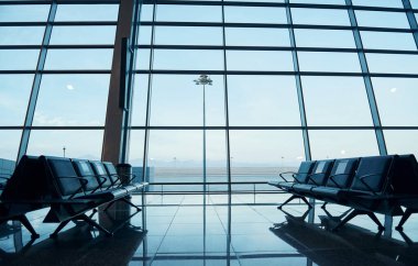 Interior of modern airport at daytime with no people inside it.