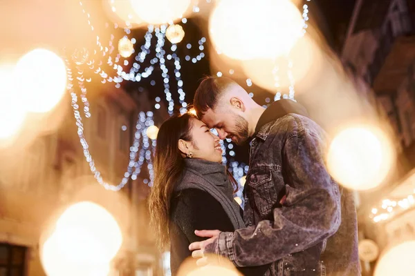 Artificial Lighting Garlands Happy Multiracial Couple Together Outdoors City Celebrating — Stock fotografie