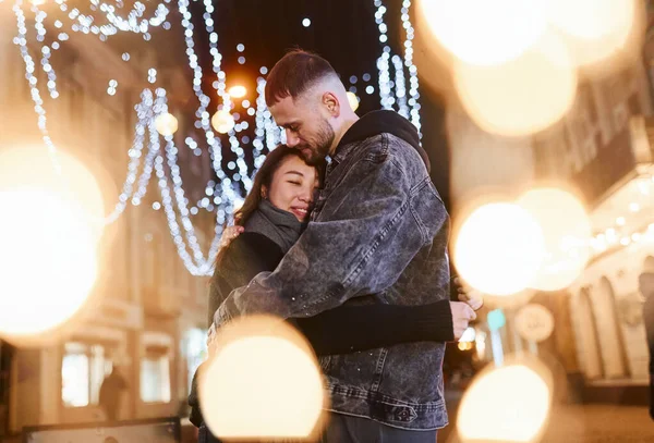 Artificial Lighting Garlands Happy Multiracial Couple Together Outdoors City Celebrating —  Fotos de Stock