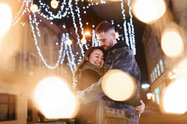 Artificial Lighting Garlands Happy Multiracial Couple Together Outdoors City Celebrating —  Fotos de Stock