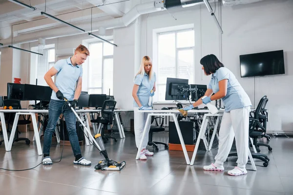 Cleans Floor Group Workers Clean Modern Office Together Daytime — Zdjęcie stockowe