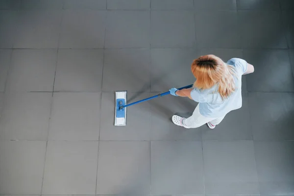 Top View Woman Blue Shirt Protective Gloves Uses Vacuum Cleaner — Zdjęcie stockowe