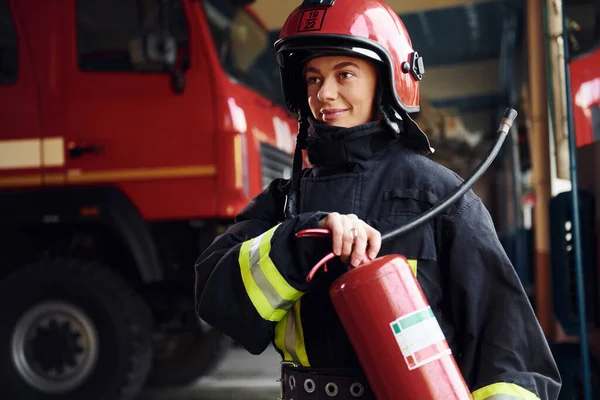 Holds Extinguisher Hands Female Firefighter Protective Uniform Standing Truck — Zdjęcie stockowe