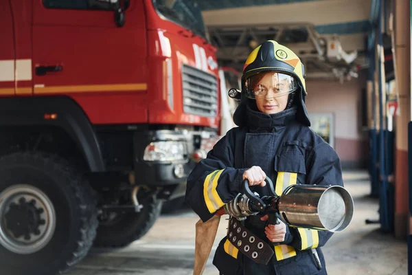 Hose Hands Female Firefighter Protective Uniform Standing Truck — Zdjęcie stockowe