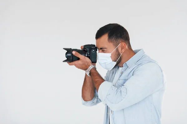 Professional Camera Young Handsome Man Standing Indoors White Background — Stockfoto