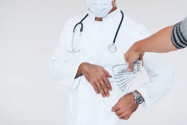 Medic Takes Bribe Close Particle View Young Man Standing Indoors — Stock fotografie